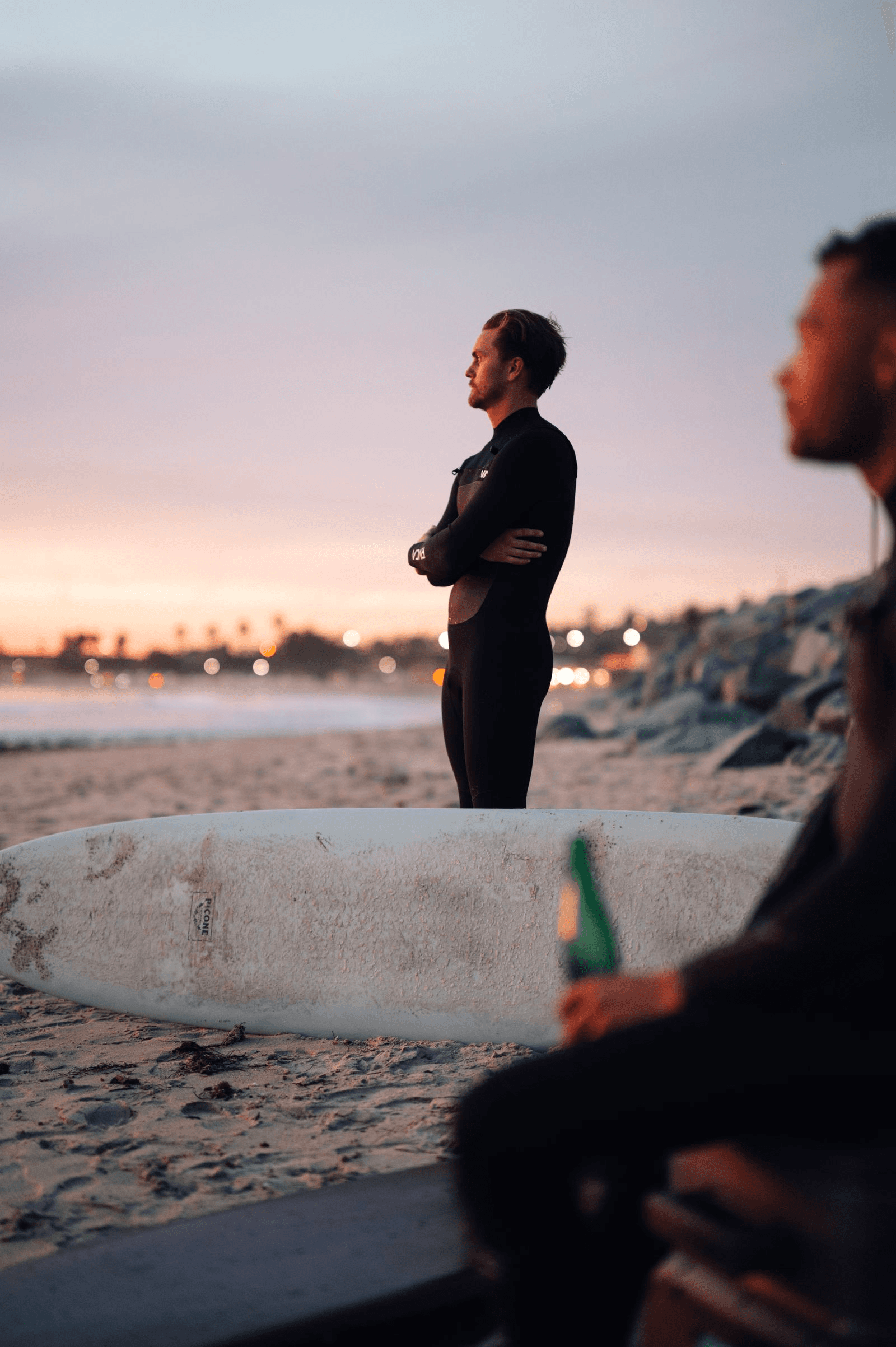 Surfers at sunset