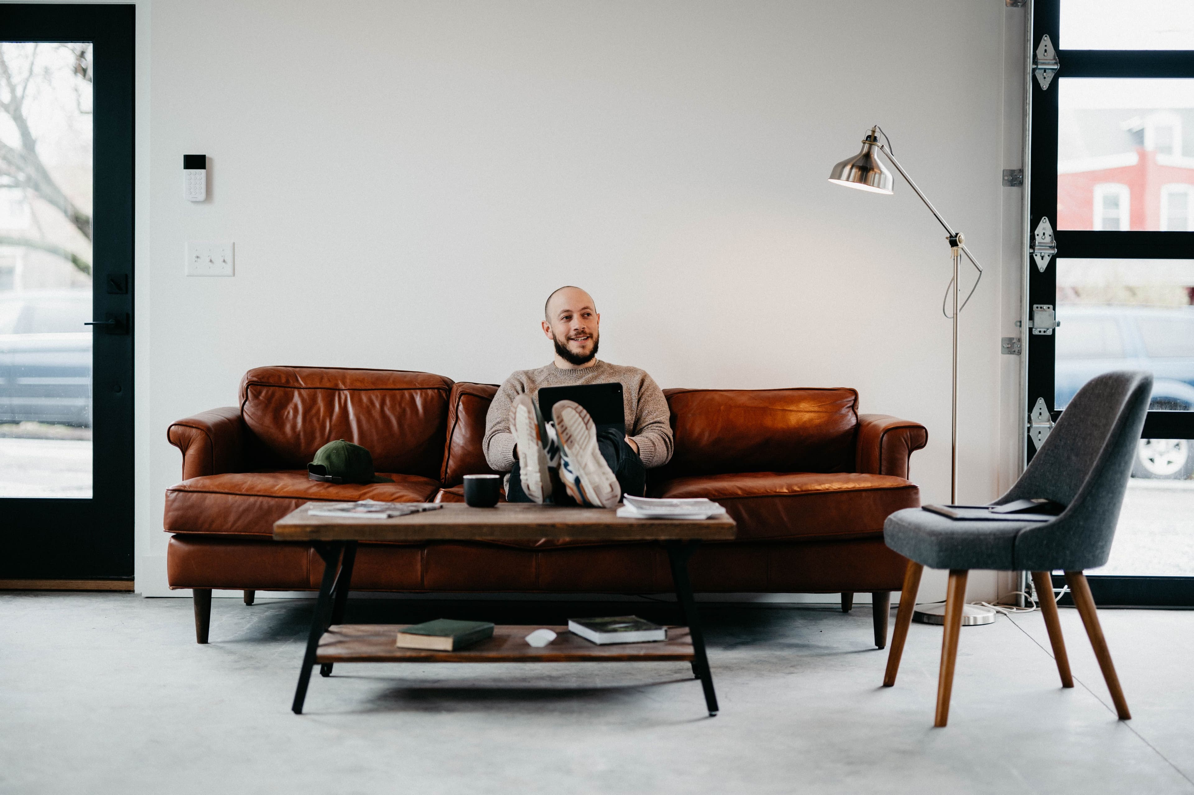 Man on leather sofa