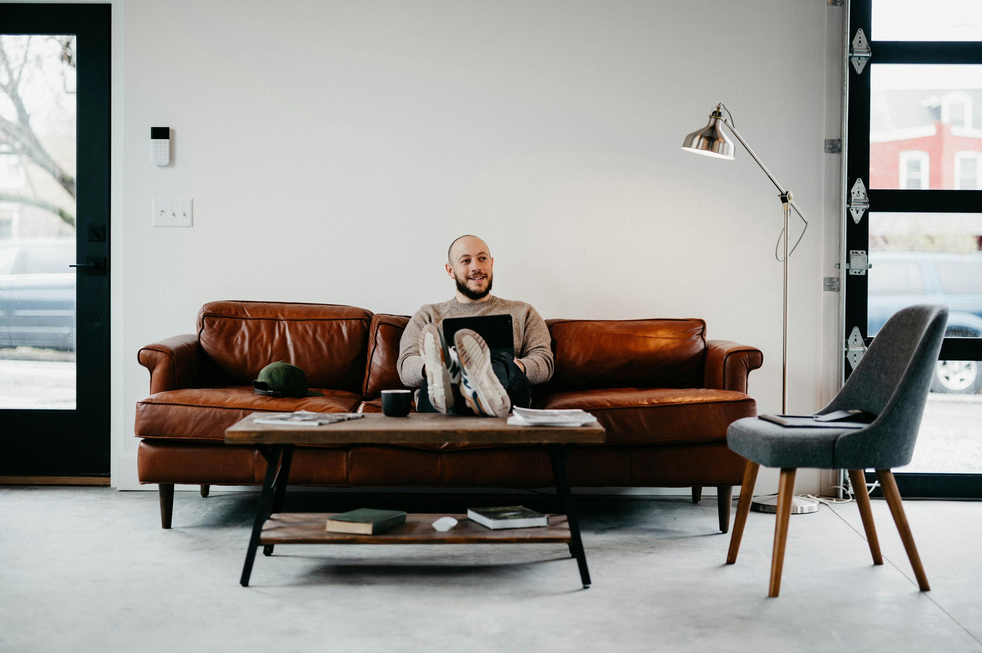 Man on leather sofa