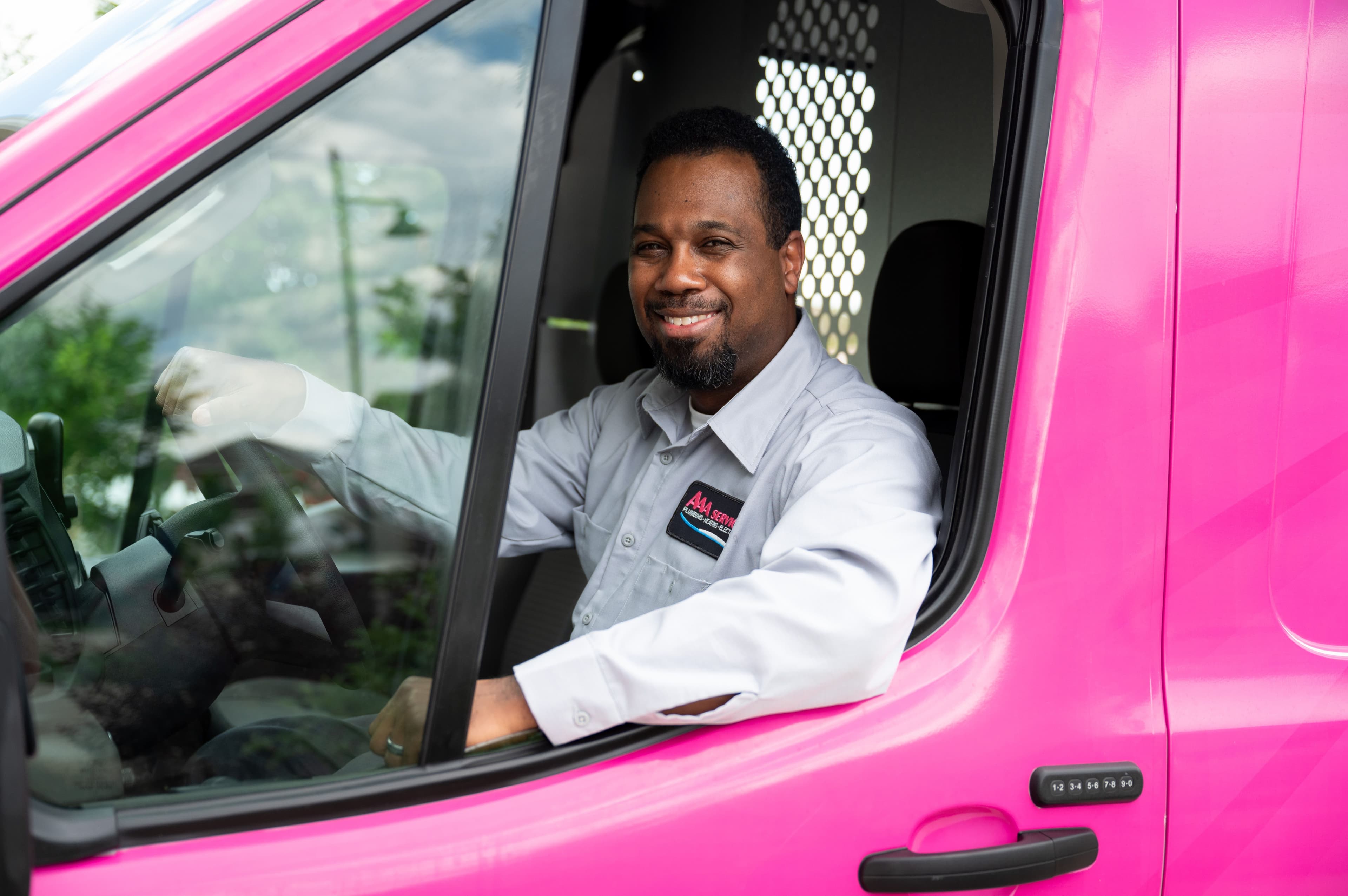 man in a pink truck