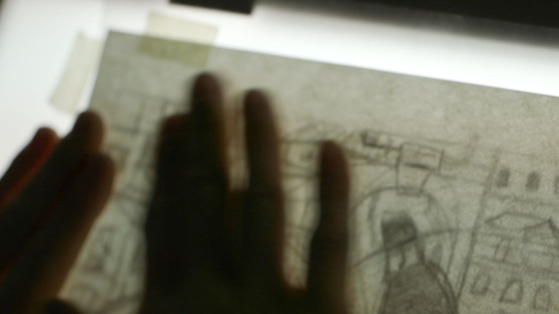 Jared Boggess drawing on his light table