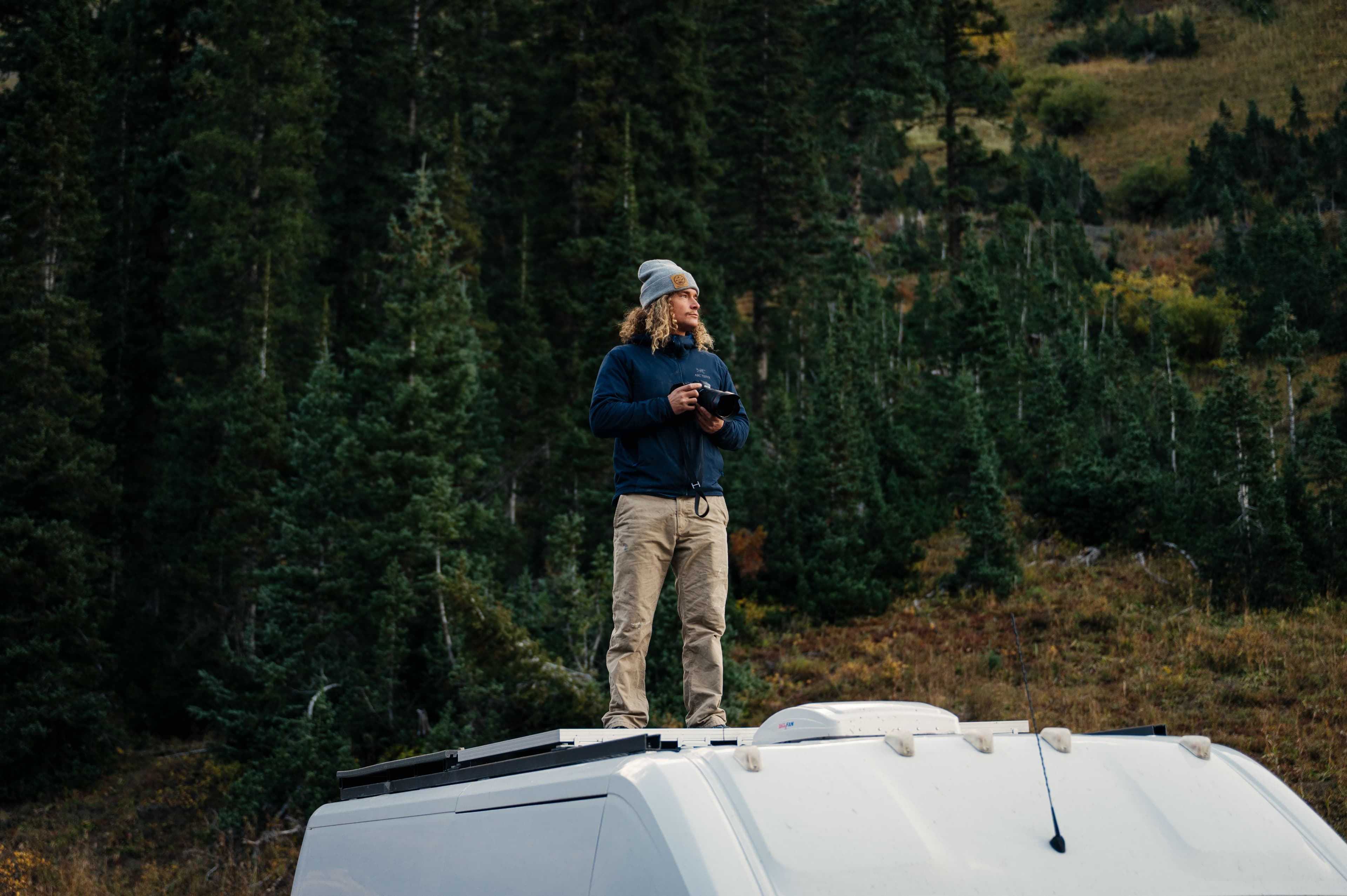 Justin Krompier on top of his van